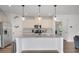 Bright kitchen with granite countertops, stainless steel appliances, and modern white cabinetry at 5751 Green Arbor Way, Sugar Hill, GA 30518