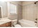 Bathroom view showcasing natural light, tiled shower, and vanity at 1024 Burke St # 56, Lawrenceville, GA 30046