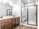 Main bathroom with double vanity, and walk-in shower with shower bench at 1024 Burke St # 56, Lawrenceville, GA 30046