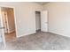 Bedroom view featuring neutral walls, carpeted flooring, and white doors at 1024 Burke St # 56, Lawrenceville, GA 30046