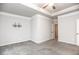 Bedroom featuring tray ceiling, ceiling fan and wall-mounted TV bracket at 1024 Burke St # 56, Lawrenceville, GA 30046
