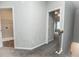 Second floor hallway leading to laundry room, and showing staircase at 1024 Burke St # 56, Lawrenceville, GA 30046
