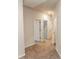 Hallway with neutral carpet, recessed lighting, and white doors leading to other rooms at 1024 Burke St # 56, Lawrenceville, GA 30046