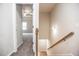 Hallway view leading to the living room and stairs with wood handrail at 1024 Burke St # 56, Lawrenceville, GA 30046