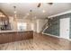 Spacious kitchen with granite countertops, wooden cabinets and floors, and stylish lighting at 1024 Burke St # 56, Lawrenceville, GA 30046