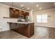 Kitchen featuring stainless steel appliances, granite countertops, an island, and hardwood floors at 1024 Burke St # 56, Lawrenceville, GA 30046