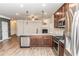 Modern kitchen features stainless steel appliances, granite countertops, and a large island at 1024 Burke St # 56, Lawrenceville, GA 30046