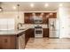 Modern kitchen featuring stainless steel appliances, granite countertops, and a center island at 1024 Burke St # 56, Lawrenceville, GA 30046