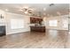 Open-concept living room featuring hardwood floors, recessed lighting, and a cozy fireplace at 1024 Burke St # 56, Lawrenceville, GA 30046