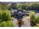 Community clubhouse surrounded by tennis courts and lush greenery, offering a vibrant recreational space at 174 Riverwood Dr, Dallas, GA 30157