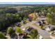 Serene community surrounded by lush trees and a tranquil lake in the distance at 174 Riverwood Dr, Dallas, GA 30157