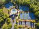 Community amenities featuring multiple tennis courts, a pool, and well-maintained landscaping at 174 Riverwood Dr, Dallas, GA 30157