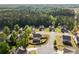 Aerial view of the backyard, illustrating the surrounding neighborhood and lush greenery at 174 Riverwood Dr, Dallas, GA 30157