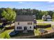Charming backyard features a trampoline, playhouse, and a well-maintained lawn, perfect for outdoor enjoyment at 174 Riverwood Dr, Dallas, GA 30157