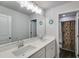Bathroom featuring double sinks, granite countertops, and modern fixtures at 174 Riverwood Dr, Dallas, GA 30157