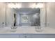 Bathroom with double sink vanity, granite countertop, and modern fixtures at 174 Riverwood Dr, Dallas, GA 30157