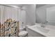 Stylish bathroom featuring a shower-tub combo, modern vanity, and decorative shower curtain at 174 Riverwood Dr, Dallas, GA 30157