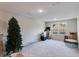 Bright bonus room with plush carpeting, large window, and ample space for versatile use at 174 Riverwood Dr, Dallas, GA 30157
