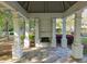 View of the community gazebo with stone fireplace, stone pavers, and pillars at 174 Riverwood Dr, Dallas, GA 30157