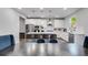 Modern kitchen with stainless steel appliances, large island, and sleek white cabinets at 174 Riverwood Dr, Dallas, GA 30157