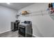 Laundry room with a modern washer and dryer with shelving at 174 Riverwood Dr, Dallas, GA 30157