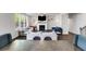 Cozy living room with fireplace, large windows and hardwood floors at 174 Riverwood Dr, Dallas, GA 30157