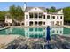 Relaxing community pool with ample lounge chairs and a clubhouse, creating an inviting oasis at 174 Riverwood Dr, Dallas, GA 30157