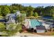 Community pool and clubhouse surrounded by lush greenery, offering a perfect blend of recreation and relaxation at 174 Riverwood Dr, Dallas, GA 30157