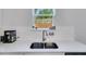 Close-up of a kitchen sink with stainless steel faucet and white countertop at 174 Riverwood Dr, Dallas, GA 30157
