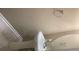 Simple bathroom features a white pedestal sink and a large mirror, creating a clean and functional space at 2253 Dillard Xing, Tucker, GA 30084