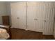 Spacious bedroom features multiple closets and hardwood flooring at 2253 Dillard Xing, Tucker, GA 30084