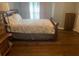 Cozy bedroom with hardwood floors, a bed, and furniture at 2253 Dillard Xing, Tucker, GA 30084