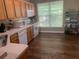 Bright kitchen with wood cabinets, modern appliances, and a large window, offering a functional and inviting space at 2253 Dillard Xing, Tucker, GA 30084