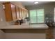 Functional kitchen with ample cabinet space, a breakfast bar, and modern appliances at 2253 Dillard Xing, Tucker, GA 30084