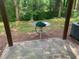 Patio space with lush greenery in the background at 2253 Dillard Xing, Tucker, GA 30084