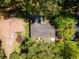 Aerial view of the house, showing its roof and the surrounding green trees at 2704 Terratim Ln, Decatur, GA 30034