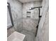 Luxurious bathroom with marble tile, a rain shower head, and a built-in shower niche at 2704 Terratim Ln, Decatur, GA 30034