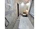 Gorgeous bathroom featuring marble tile, a soaker tub, and a sleek, modern design at 2704 Terratim Ln, Decatur, GA 30034
