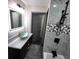Elegant bathroom showcasing stylish tilework, a glass vessel sink, and modern fixtures at 2704 Terratim Ln, Decatur, GA 30034