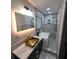 Stunning bathroom featuring marble tile, a modern soaker tub, and a beautiful gold sink at 2704 Terratim Ln, Decatur, GA 30034