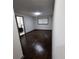 An empty bedroom with a window and access to the bathroom at 2704 Terratim Ln, Decatur, GA 30034