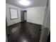 A bedroom with a window and dark wood floors at 2704 Terratim Ln, Decatur, GA 30034