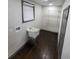 Laundry room with a sink, window, and closet shelves at 2704 Terratim Ln, Decatur, GA 30034