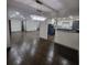 Spacious living room with hardwood floors and recessed lighting, flowing into an open kitchen area at 2704 Terratim Ln, Decatur, GA 30034
