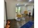 Open concept living room with decorative fireplace, dark floors and furniture at 2704 Terratim Ln, Decatur, GA 30034