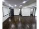 Bright and open living room featuring refinished hardwood floors, recessed lighting, and freshly painted walls at 2704 Terratim Ln, Decatur, GA 30034