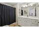 Bathroom featuring a large vanity, framed mirror, and a shower with curtain at 3040 Peachtree Nw Rd # 713, Atlanta, GA 30305