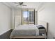Bedroom with a modern ceiling fan, and a large window offering nice exterior views at 3040 Peachtree Nw Rd # 713, Atlanta, GA 30305