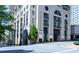 A luxury building with lush landscaping, and a roundabout entrance at 3040 Peachtree Nw Rd # 713, Atlanta, GA 30305