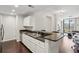 Modern kitchen with stainless steel appliances, granite countertops, and breakfast bar overlooking the living area at 3040 Peachtree Nw Rd # 713, Atlanta, GA 30305